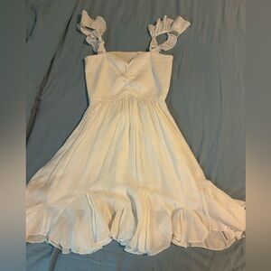 White Sleeveless Dress with Ruffle Hem